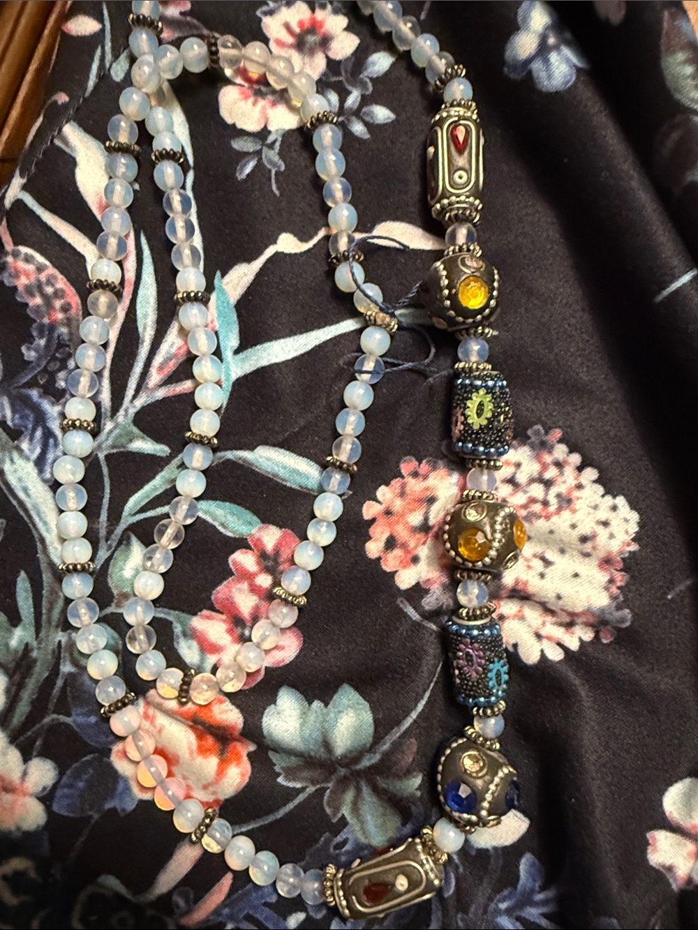 Opalescent Blue Beaded Necklace with Multicolor Accent Charms